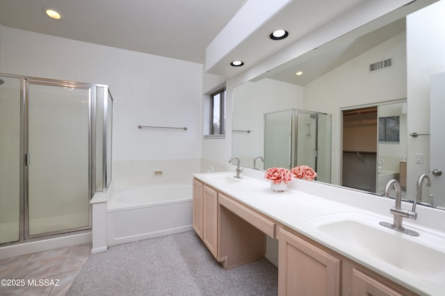 full bathroom featuring visible vents, a stall shower, a garden tub, and a sink