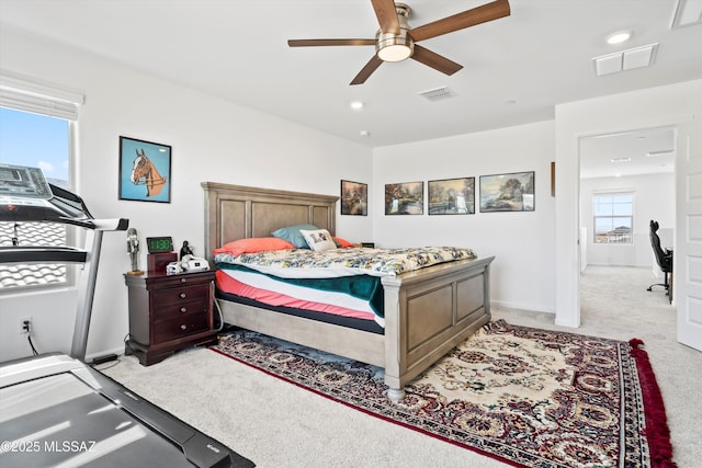 bedroom featuring light carpet, ceiling fan, visible vents, and recessed lighting