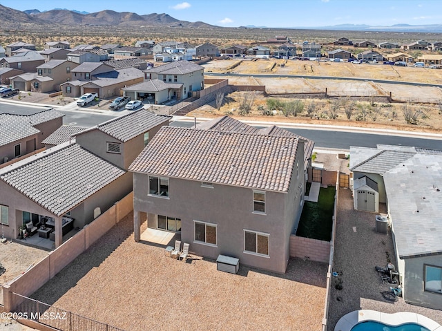 drone / aerial view featuring a mountain view and a residential view