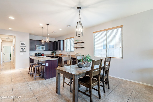 dining space with light tile patterned floors, visible vents, recessed lighting, and baseboards