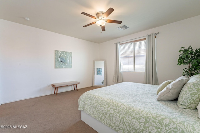 carpeted bedroom featuring visible vents and a ceiling fan