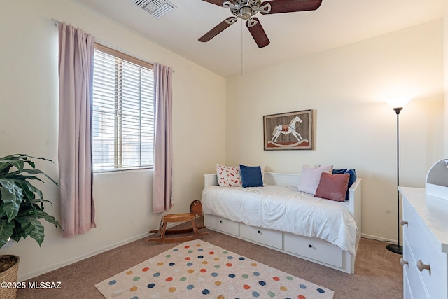 bedroom featuring light carpet, visible vents, baseboards, and a ceiling fan