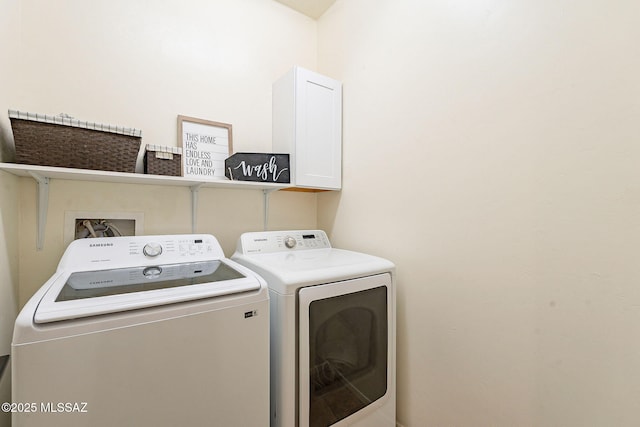 washroom featuring washing machine and clothes dryer