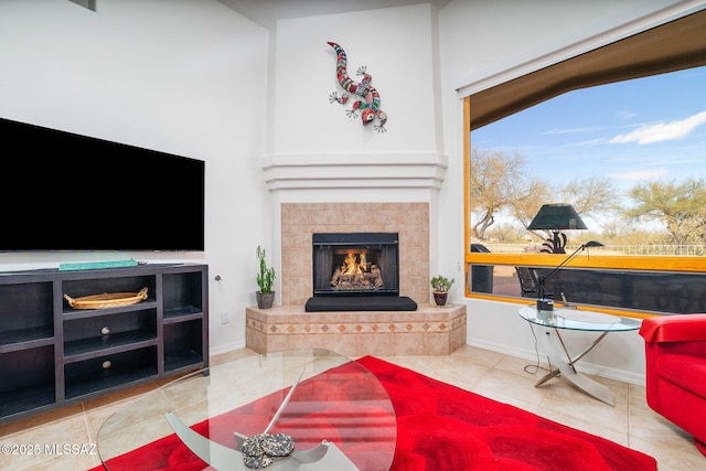 tiled living room with a tile fireplace