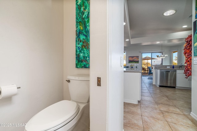 bathroom with tile patterned floors and toilet