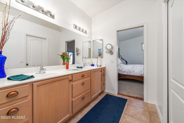 bathroom featuring tile patterned flooring and vanity