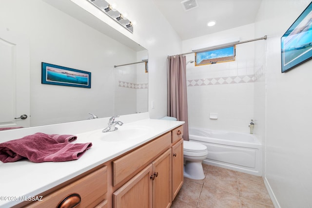 full bathroom featuring tile patterned flooring, vanity, toilet, and shower / bath combo with shower curtain