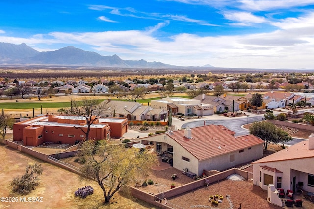 birds eye view of property featuring a mountain view