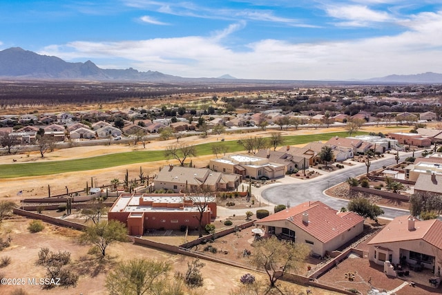 birds eye view of property with a mountain view