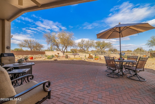 view of patio / terrace featuring ceiling fan