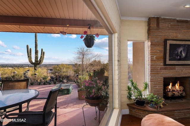 view of patio / terrace with an outdoor stone fireplace