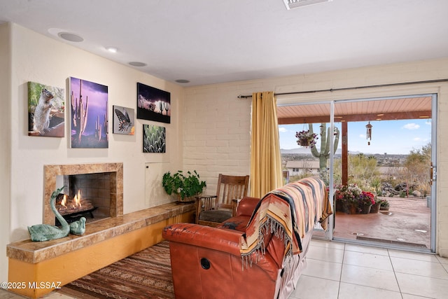 tiled living room featuring a high end fireplace