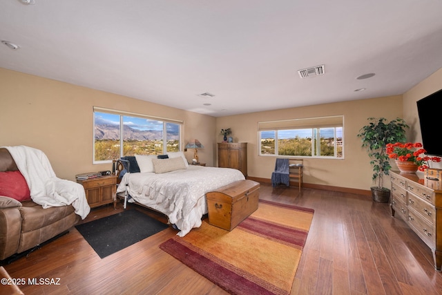 bedroom with dark wood-type flooring