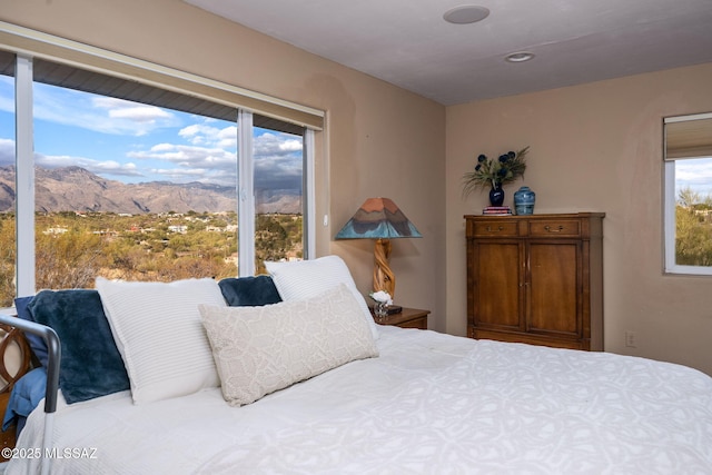 bedroom featuring a mountain view