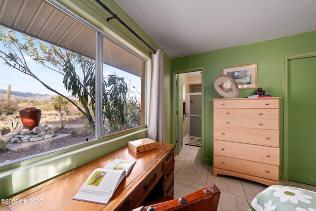 interior space with a mountain view and light tile patterned floors