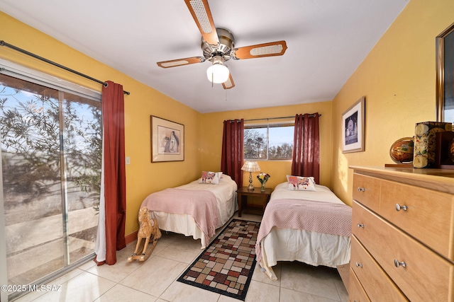 tiled bedroom with ceiling fan and access to outside