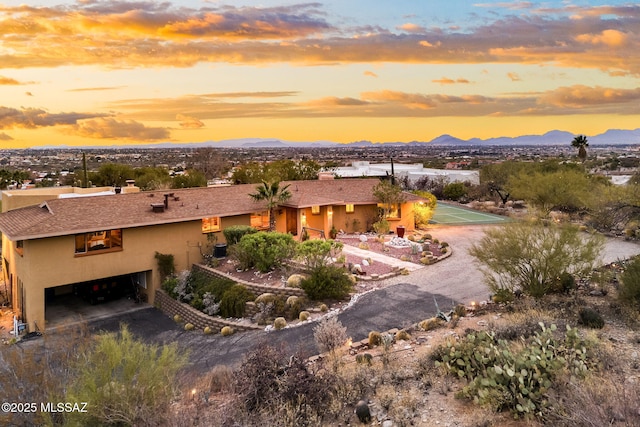 view of front of house featuring a garage and a mountain view