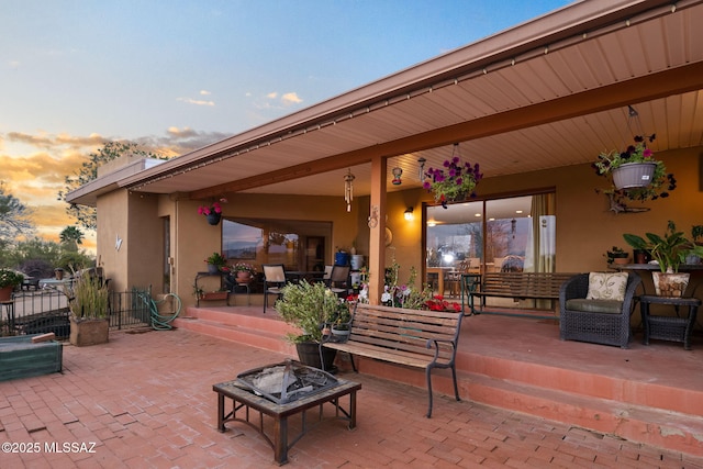 view of patio terrace at dusk