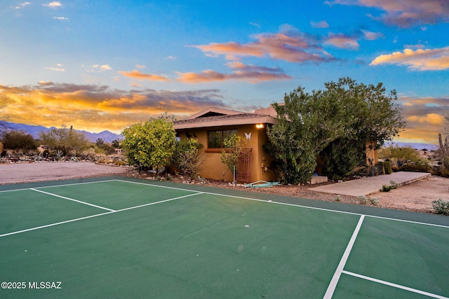 view of basketball court featuring a mountain view and tennis court