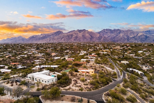 aerial view at dusk with a mountain view