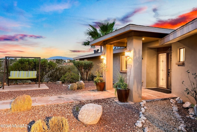 yard at dusk with a patio