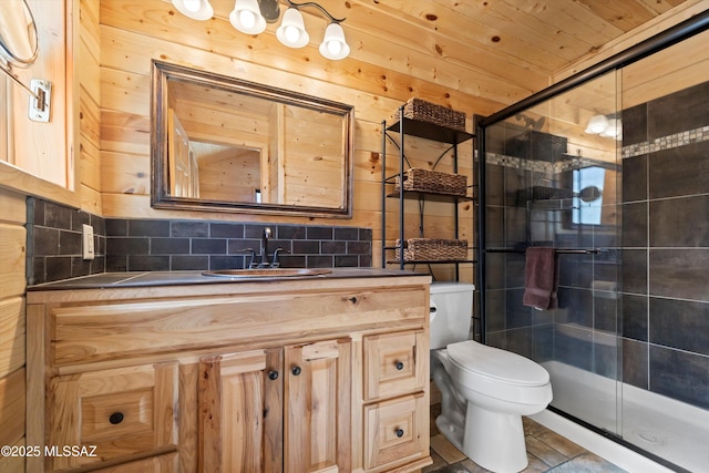 12641 N Ajo Ave, Mount Lemmon, AZ 85619 - full bathroom featuring a stall shower, toilet, vanity, tasteful backsplash, and wooden walls
