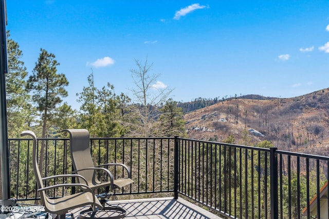 balcony featuring a mountain view