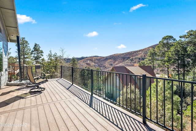 wooden terrace with a mountain view