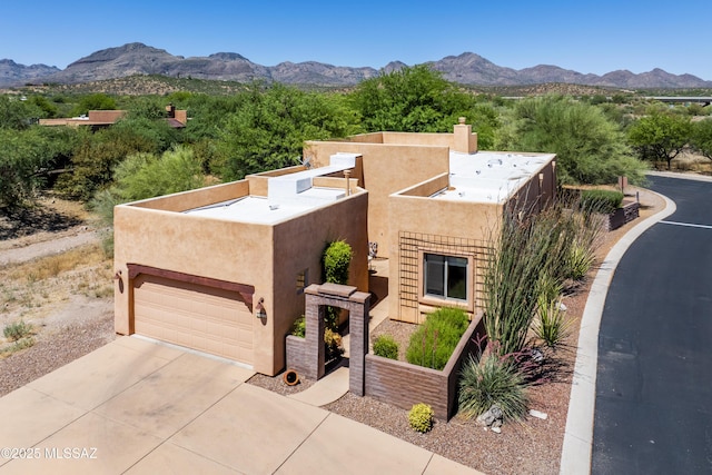 pueblo-style house featuring a mountain view