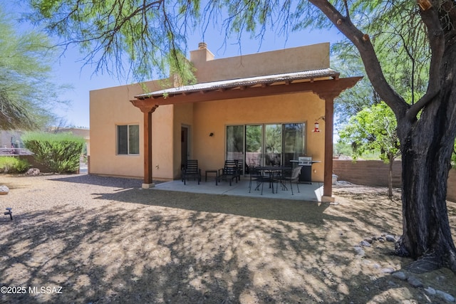 rear view of house with a patio area