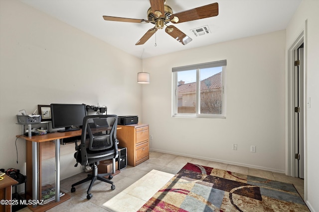 office area with ceiling fan, light tile patterned flooring, visible vents, and baseboards