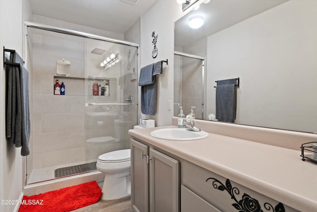 full bathroom with toilet, wood finished floors, visible vents, vanity, and a shower stall