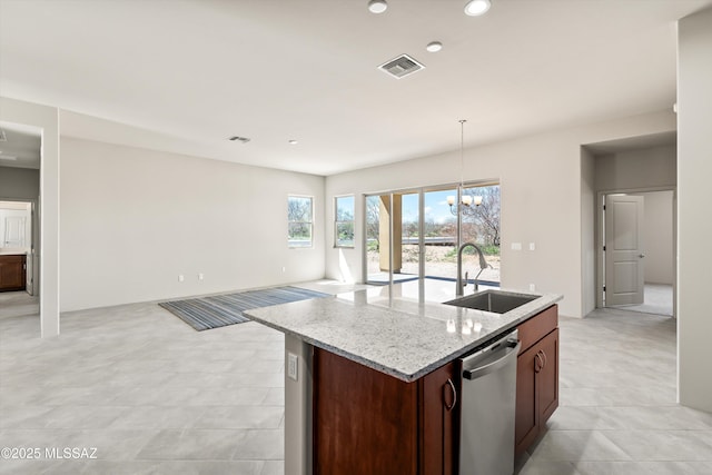 kitchen featuring visible vents, a sink, dishwasher, a notable chandelier, and a kitchen island with sink