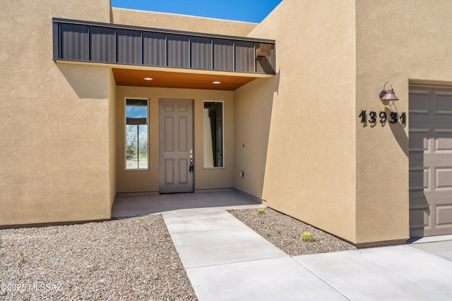 doorway to property with stucco siding