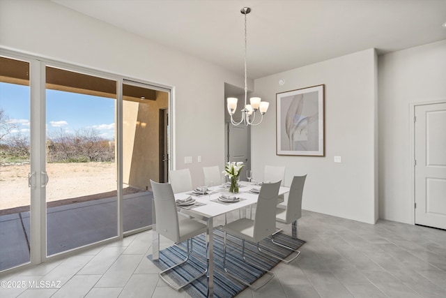 dining space with a notable chandelier