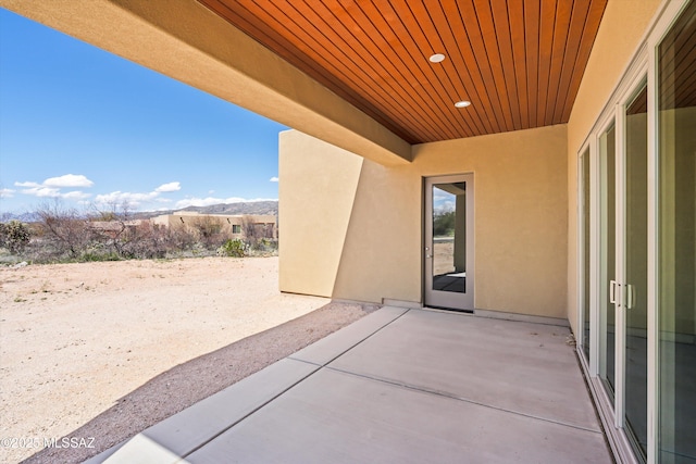 view of patio / terrace with a mountain view