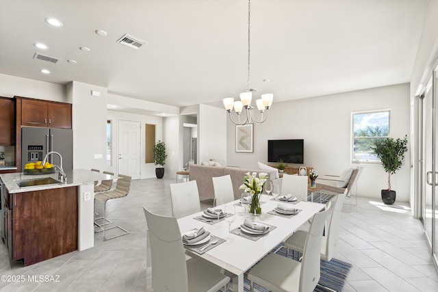 dining area featuring recessed lighting, visible vents, an inviting chandelier, and light tile patterned floors