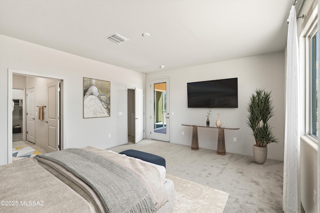 bedroom featuring visible vents, carpet, and access to outside