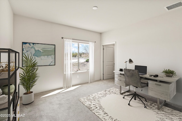 home office featuring visible vents and light carpet