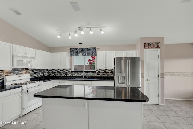 5481 W Cochie Springs St, Marana, AZ 85658 - kitchen featuring decorative backsplash, a sink, white appliances, and white cabinets