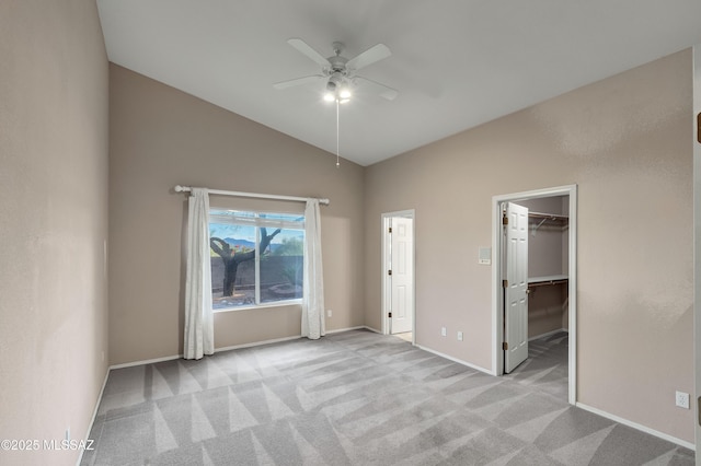 5481 W Cochie Springs St, Marana, AZ 85658 - unfurnished bedroom featuring a walk in closet, carpet floors, baseboards, and high vaulted ceiling