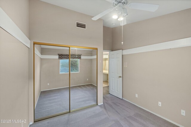 5481 W Cochie Springs St, Marana, AZ 85658 - unfurnished bedroom featuring a towering ceiling, baseboards, carpet floors, visible vents, and ceiling fan