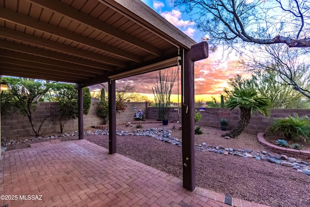 5481 W Cochie Springs St, Marana, AZ 85658 - patio terrace at dusk with a fenced backyard