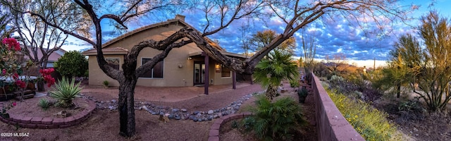 5481 W Cochie Springs St, Marana, AZ 85658 - view of property exterior with a tiled roof, a patio area, and stucco siding