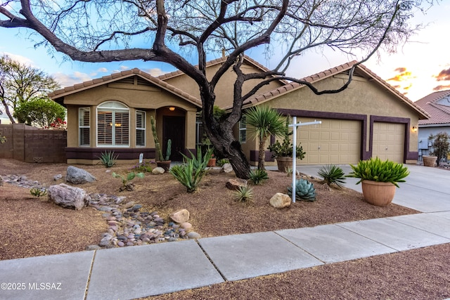 5481 W Cochie Springs St, Marana, AZ 85658 - single story home with driveway, stucco siding, an attached garage, and a tile roof