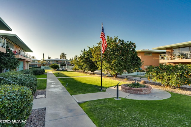 view of property's community with a yard