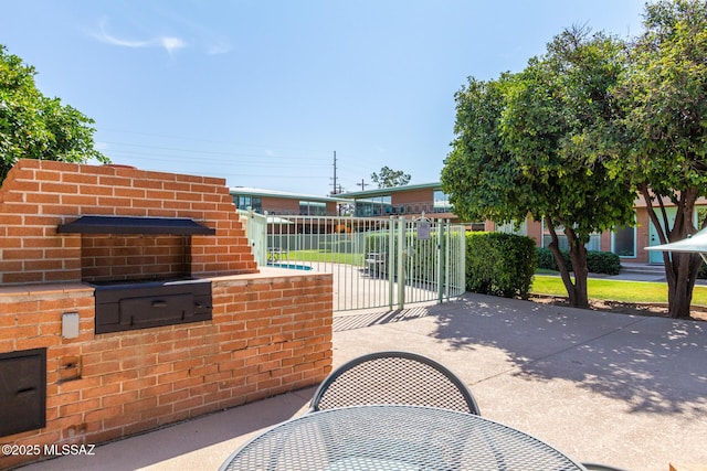 view of gate with fence