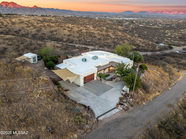 aerial view at dusk with a mountain view