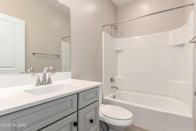 full bathroom featuring shower / tub combination, vanity, and toilet