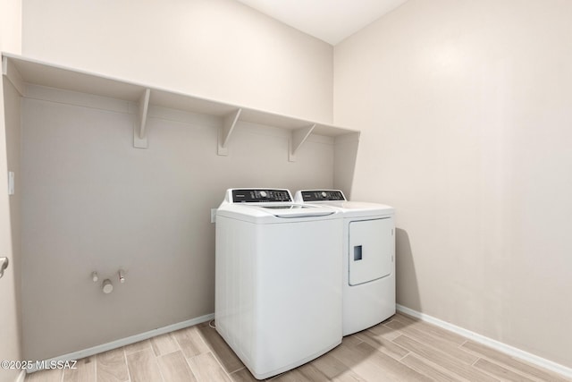 clothes washing area featuring washing machine and dryer